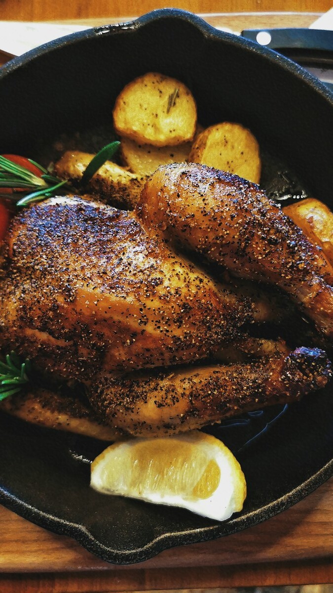 grilled meat on black round plate