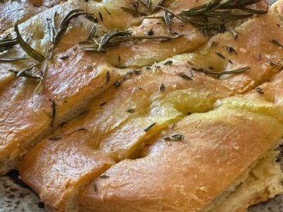 Rustic rosemary and thyme focaccia made with extra virgin olive oil