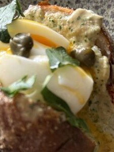 Jacket potatoes topped with egg and tonnato sauce, made with extra virgin olive oil
